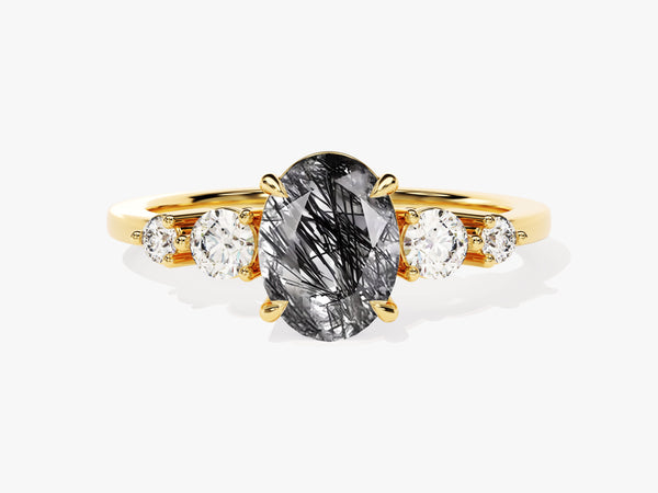 Gold ring with oval rutilated quartz and diamonds