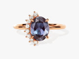 Oval alexandrite ring with diamond accents on rose gold band