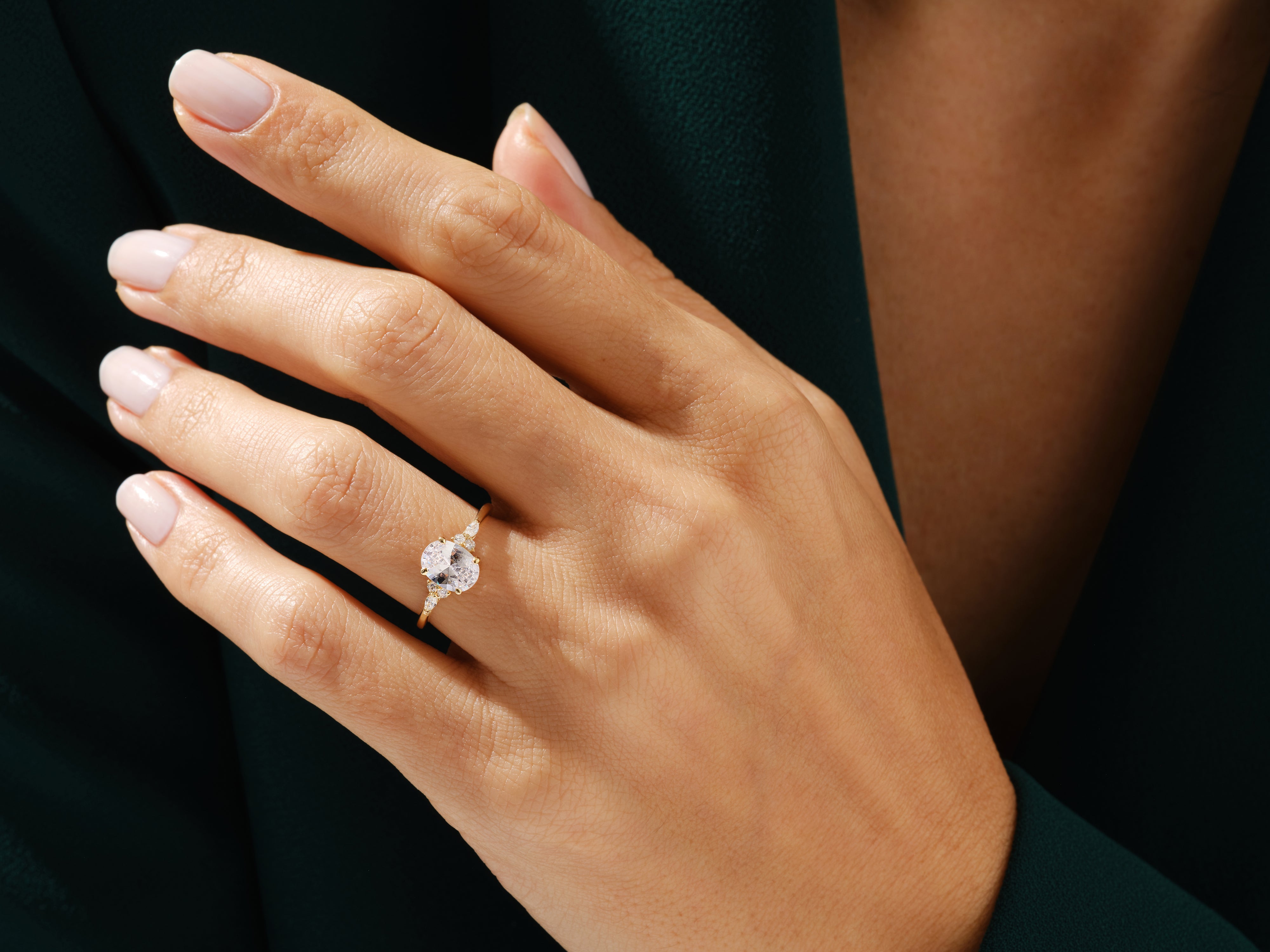Oval diamond engagement ring on a woman's hand