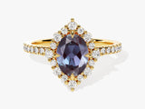 Gold ring with oval alexandrite and diamond halo
