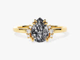 Gold ring with pear-cut rutilated quartz and diamond accents