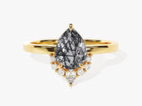 Gold ring with pear-cut rutilated quartz and diamond accents