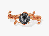 Rose gold ring with black rutilated quartz and leaf design