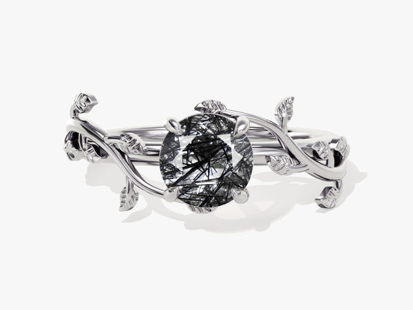 Silver ring with oval rutilated quartz and leaf design