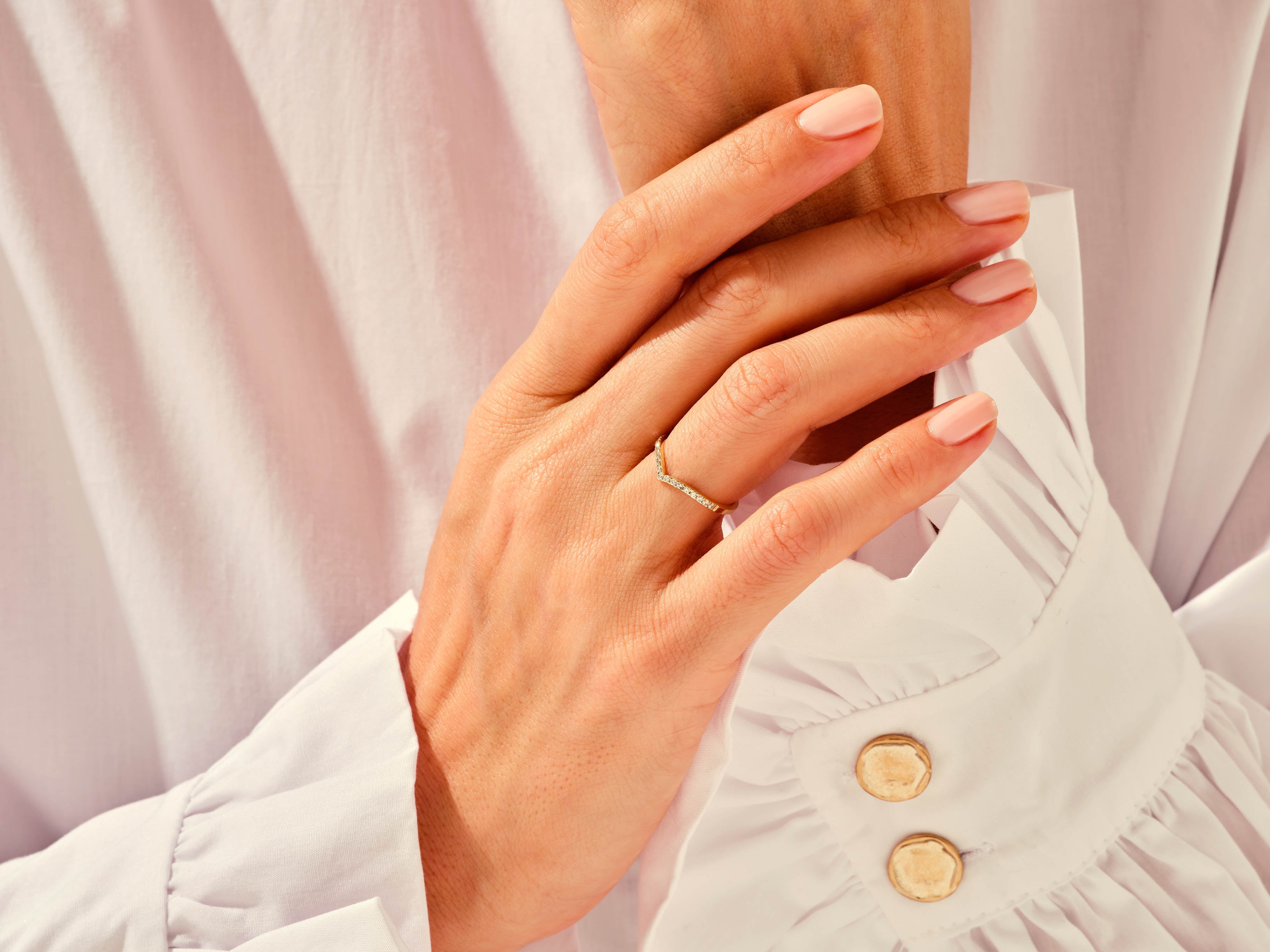 Diamond chevron ring on hand, jewelry photography