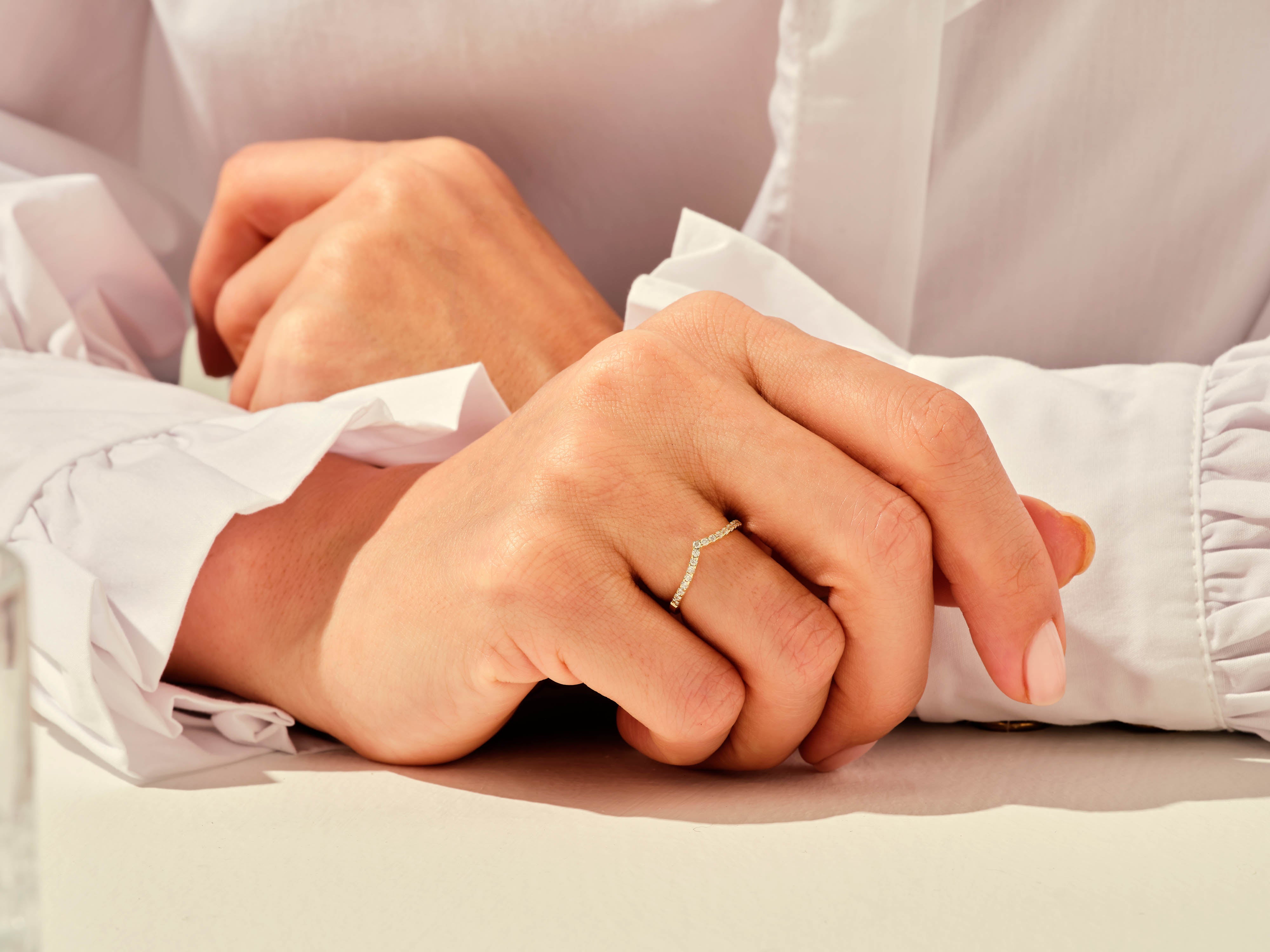 Diamond chevron ring on hand, jewelry photography