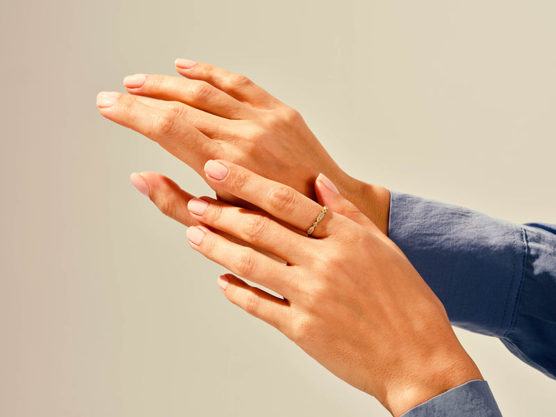 Diamond band ring on a woman's hand, elegant jewelry for her