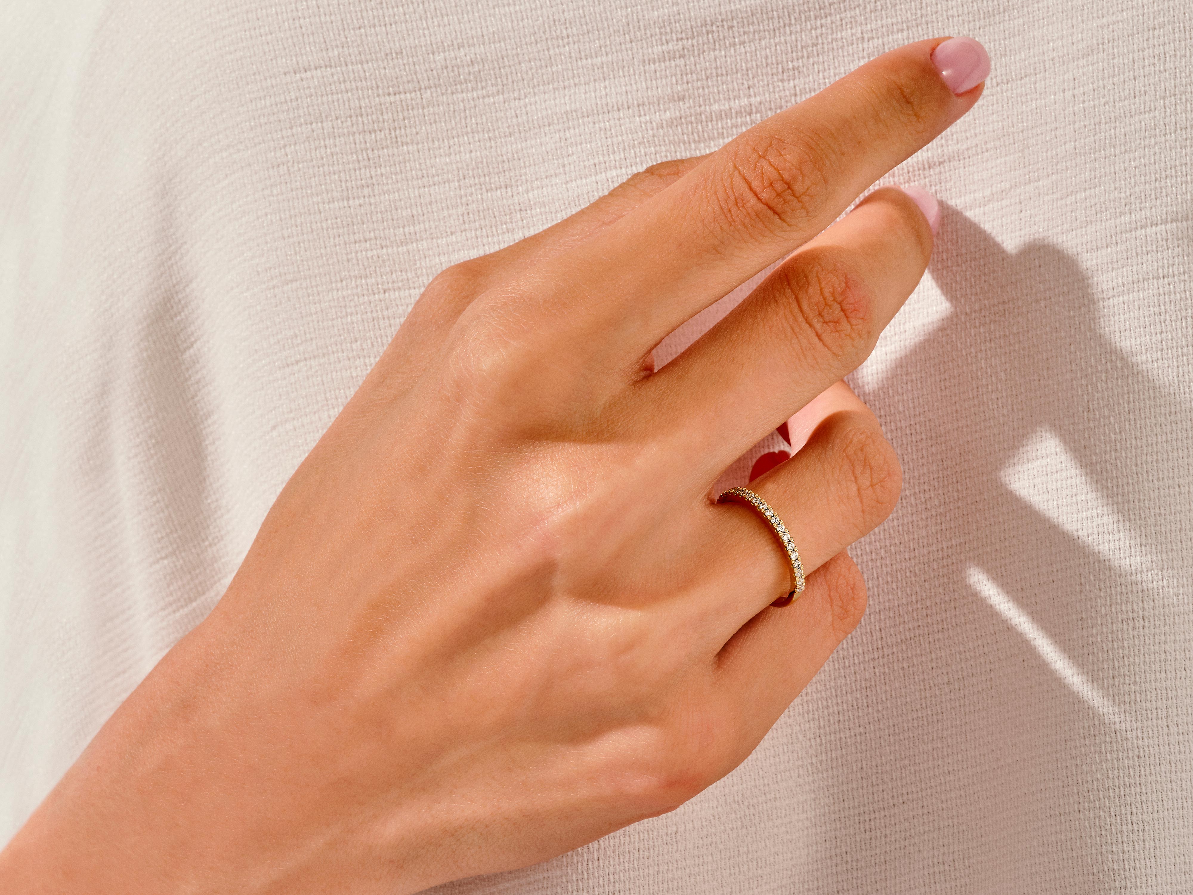 Diamond eternity ring on a hand, jewelry product photography