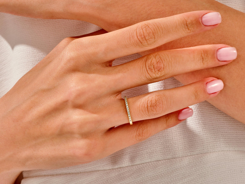 Diamond band ring on a hand, jewelry photography