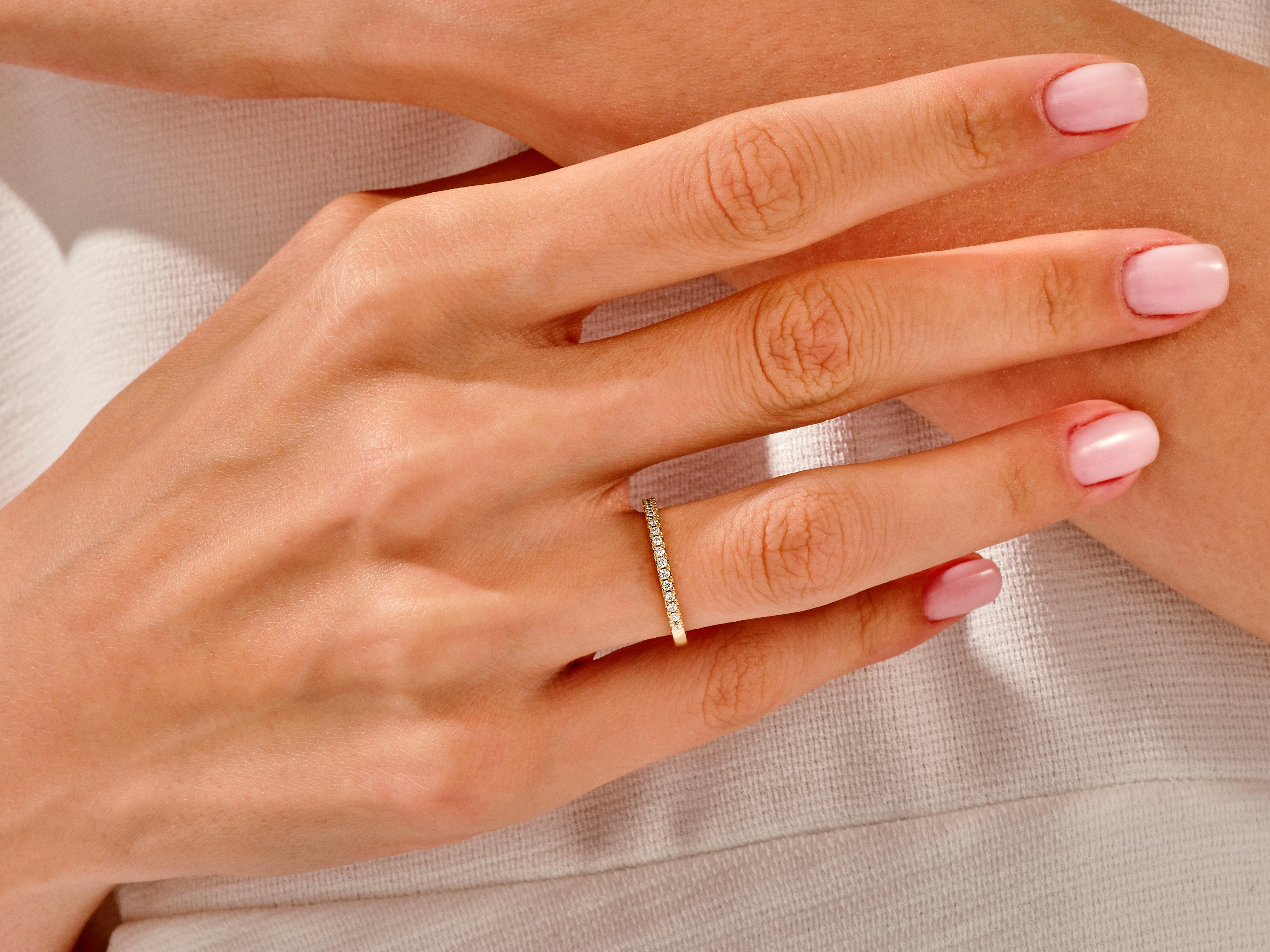 Diamond band ring on a hand, jewelry photography