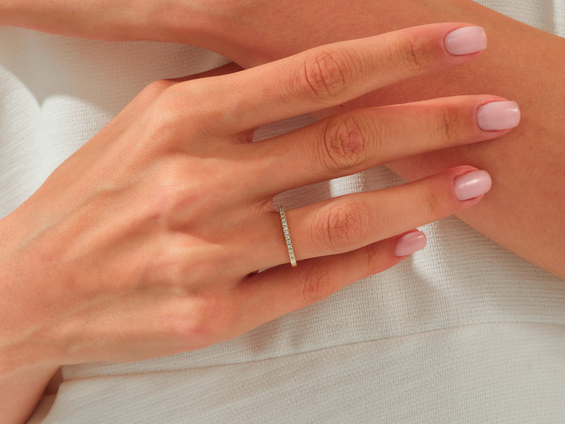 Diamond eternity ring on a woman's hand