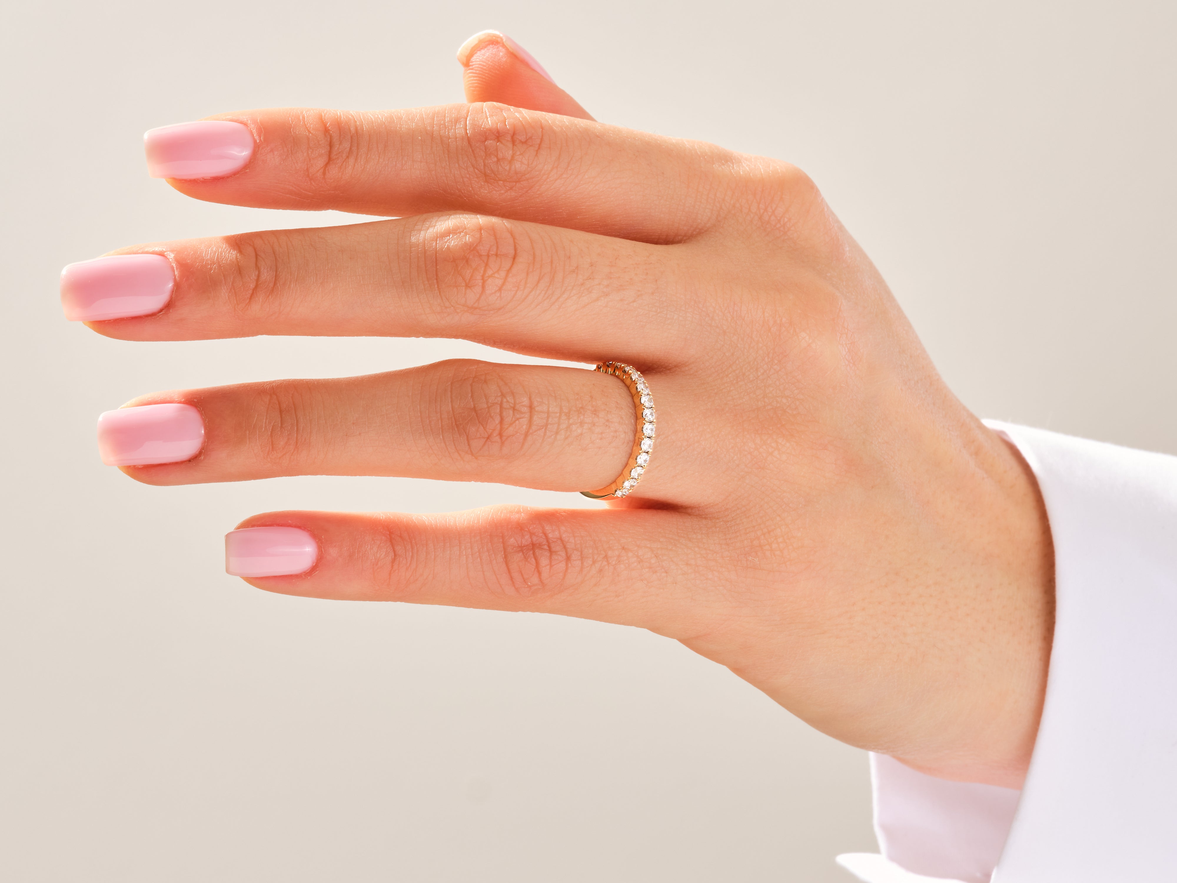 Diamond eternity ring on a hand, jewelry for her