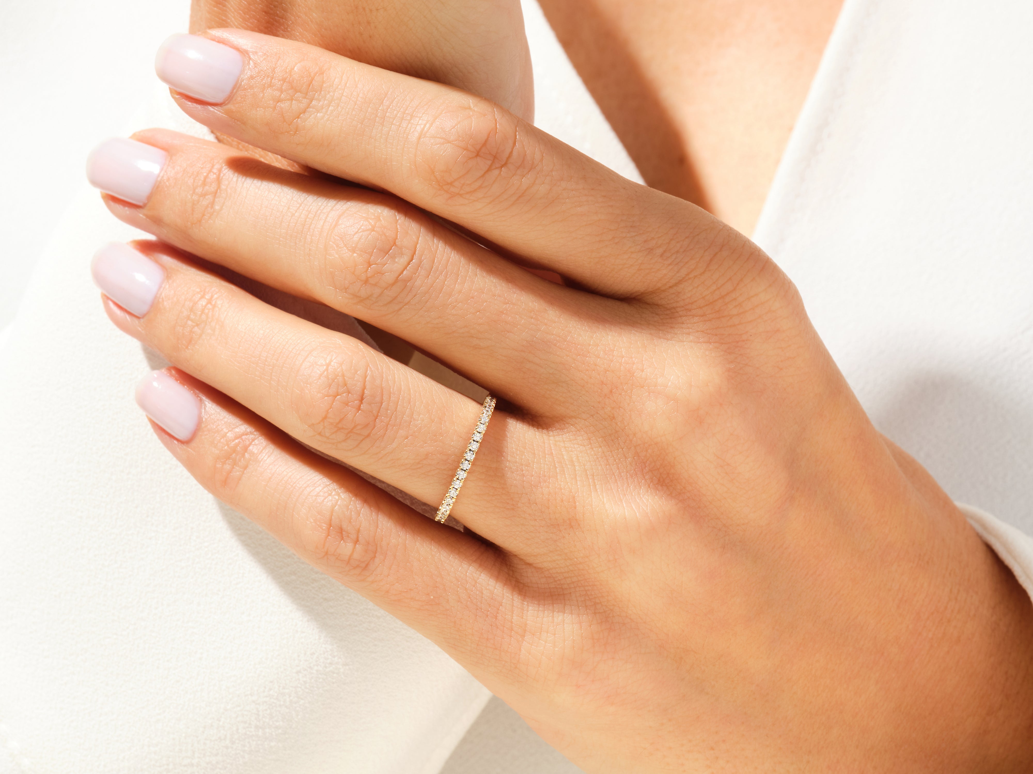 Diamond eternity ring on a woman's hand