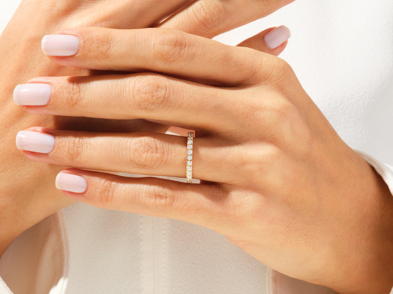 Diamond eternity ring on a hand, jewelry for her