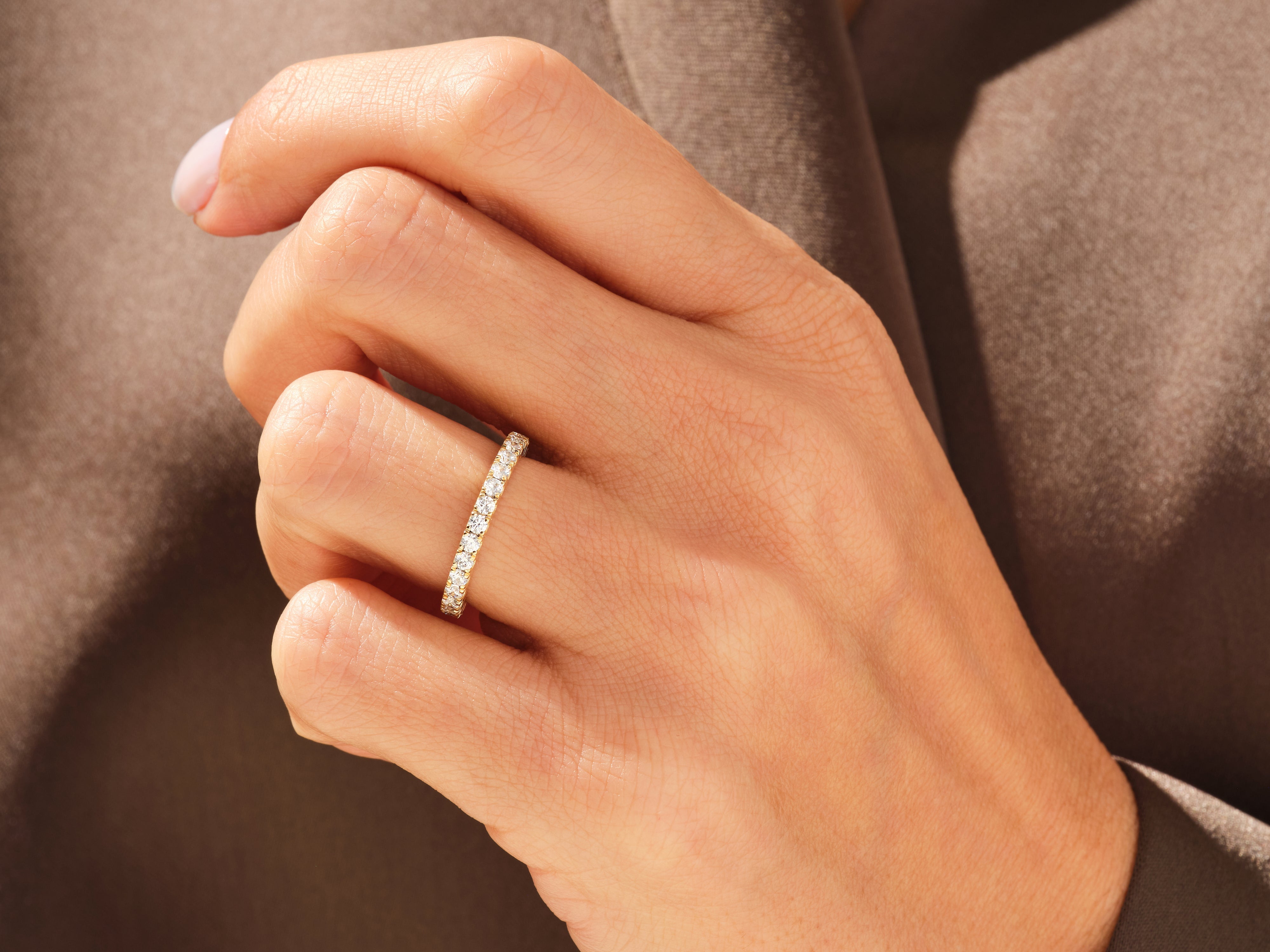 Diamond eternity band on hand, fine jewelry, luxury ring