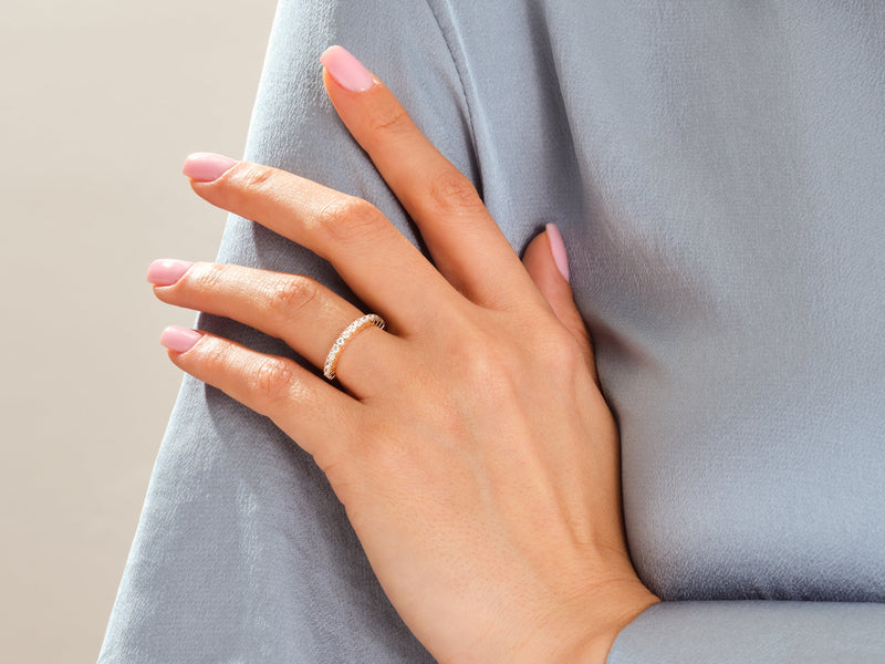 Diamond eternity ring on a hand, fine jewelry