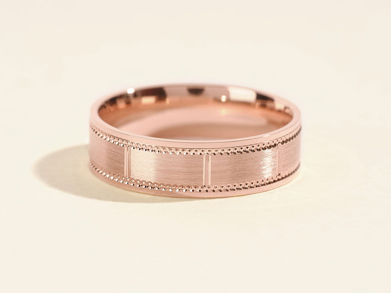 Rose gold ring with textured band and beaded edge