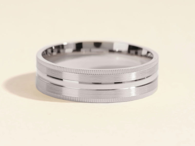 Men's brushed silver band ring with grooved edges and center inlay