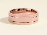 Rose gold brushed band ring with polished edges