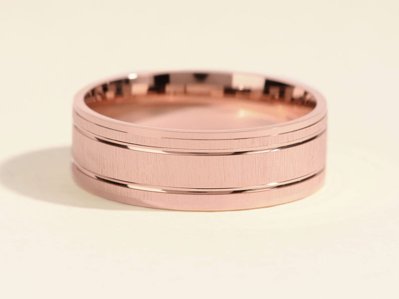 Rose gold brushed band ring with polished edges