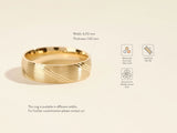 Gold wedding band with brushed finish and diagonal lines