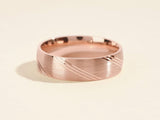 Rose gold brushed ring with diagonal etched lines jewelry