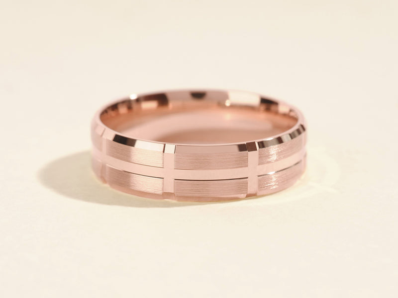 Rose gold ring with brushed finish and geometric pattern