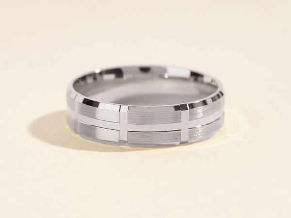Men's brushed silver wedding band with geometric design
