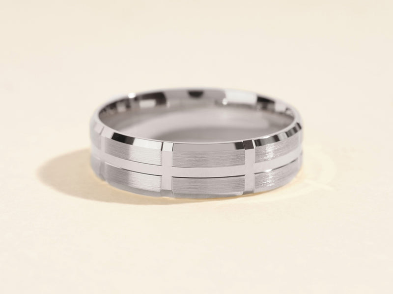 Men's brushed silver wedding band with geometric design