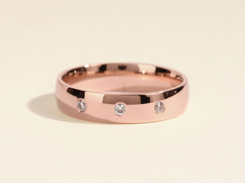 Rose gold band ring with three diamonds, jewelry