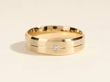 Gold wedding band with diamond accent, jewelry