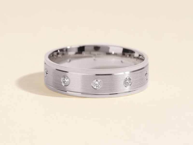 Diamond inlaid brushed metal ring for jewelry collection
