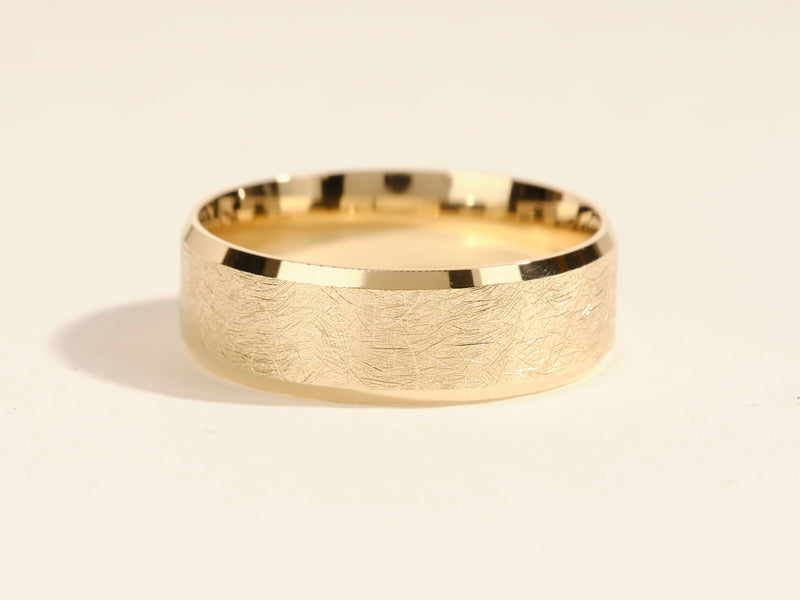 Textured gold wedding band from jewelry company