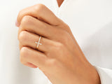 Diamond cross ring on a woman's finger, fine jewelry
