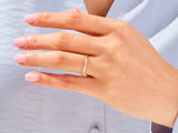 Diamond band ring on a woman's finger, jewelry product