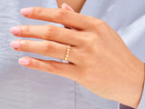 Gold diamond ring on a woman's hand, jewelry