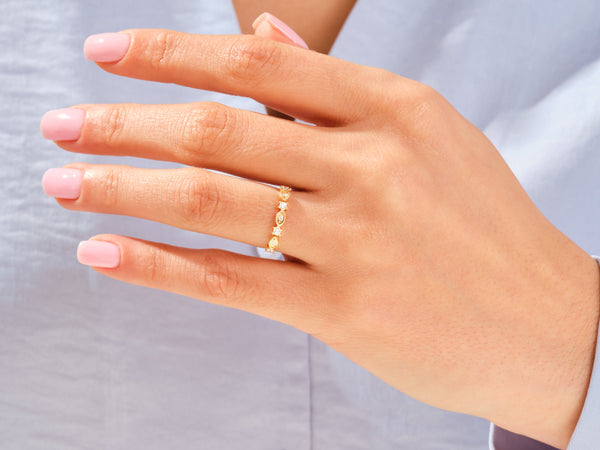 Gold diamond ring on a woman's hand, jewelry
