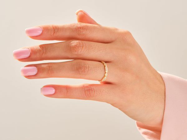 Diamond and gold ring on a hand, jewelry