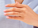 Diamond curved ring on a woman's hand, jewelry