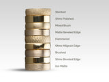 Stack of gold wedding bands with various finishes and textures