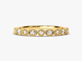 Gold diamond ring with beaded bezel setting