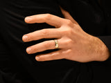 Gold wedding band on a man's finger, jewelry for men