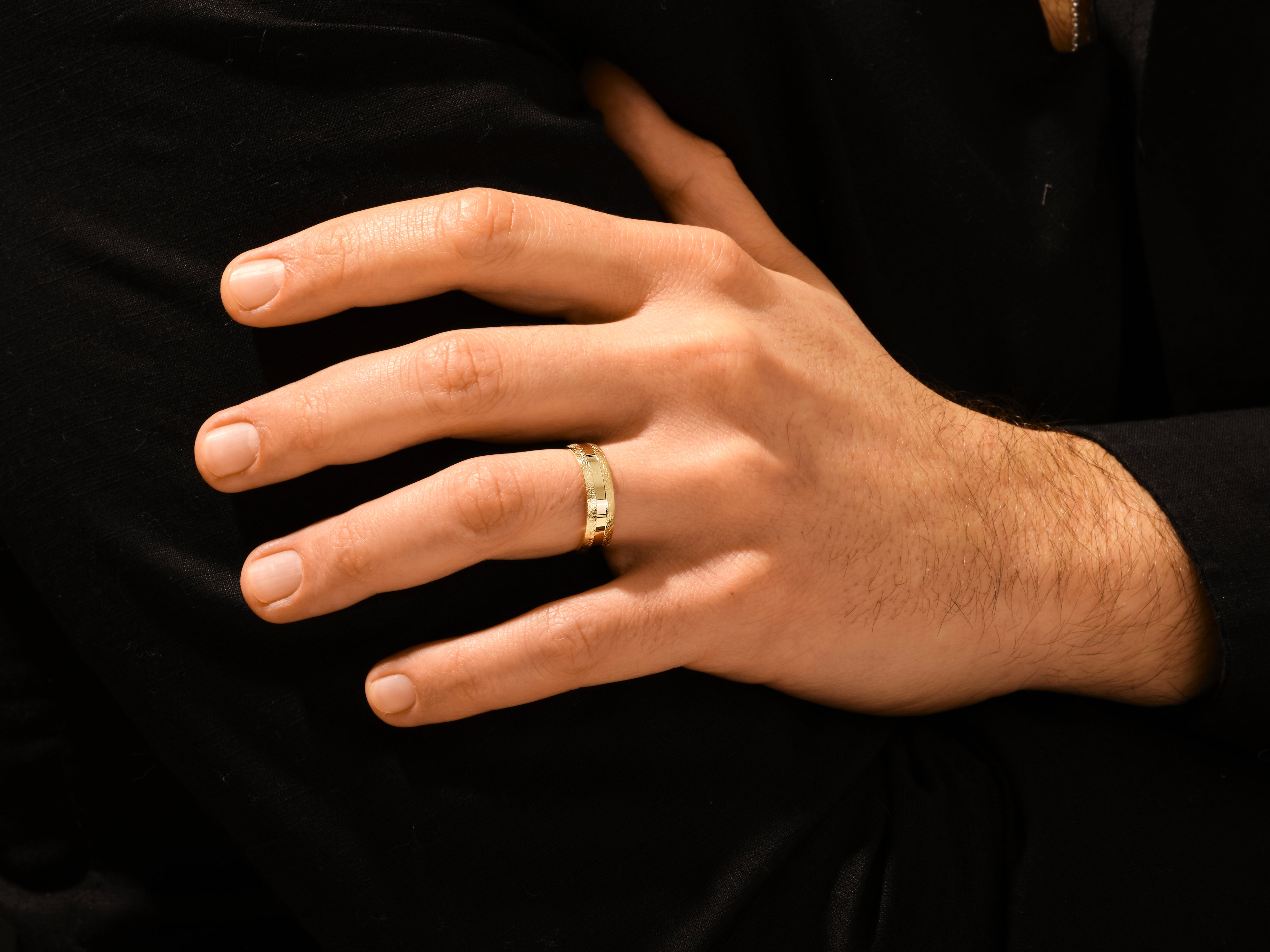 Gold ring on hand, jewelry for men, elegant design