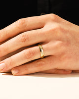 Gold diamond ring on a man's hand, jewelry product
