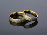 Textured gold wedding bands from jewelry firm