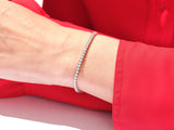 Diamond tennis bracelet on wrist, luxury jewelry
