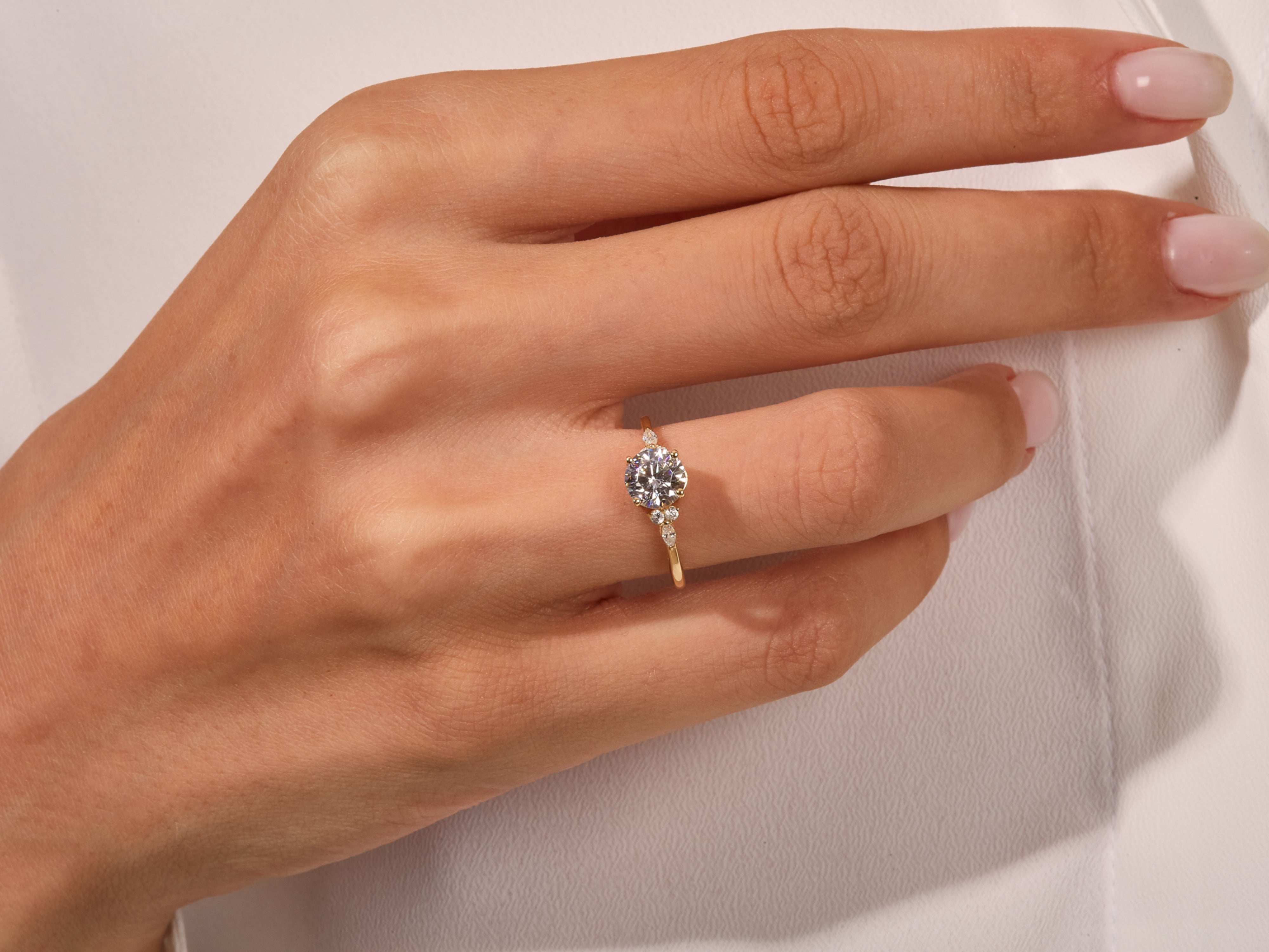 Diamond engagement ring on a woman's finger, fine jewelry