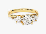 Gold three-stone diamond engagement ring with pave band