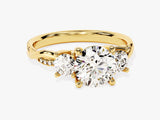 Gold three-stone diamond engagement ring with twisted band