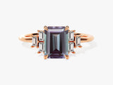 Emerald cut alexandrite ring with baguette diamonds on rose gold band